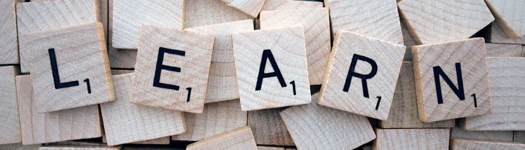 scrabble tiles spelling "learn"